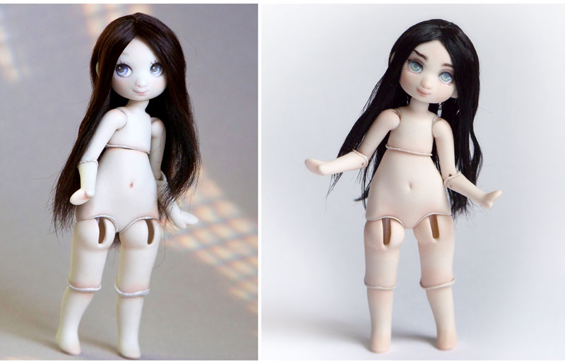 two pale skinned meka dolls with stright dark hair and two different looks
