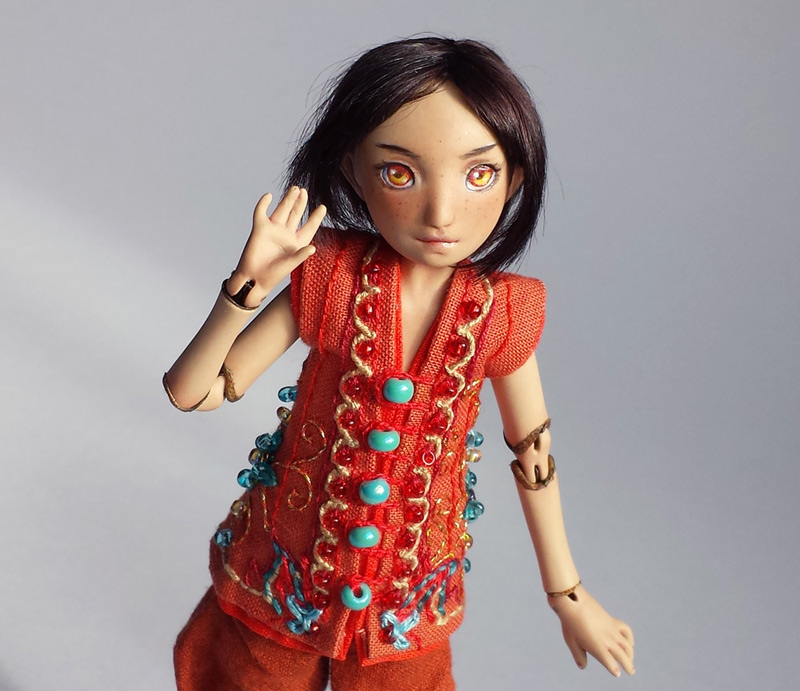 tan bjd in orange jacket