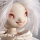 eka doll with a toothy grin.
