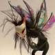 a polymer clay fairy creature with white mask, original sculpture by ladymeow