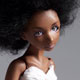 little minion doll, a dark skinned porcelain bjd with natural hair and a handmade white dress by ladymeow