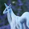 sculpture of a pale blue unicorn with white mane and tail by ladymeow